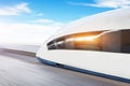 Railroad travel passenger train high speed with motion blur effect, against the blue sky Royalty Free Stock Photo