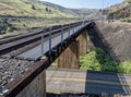 A railroad trestle crosses Highway 216 at Winter Water Creek near Tygh Valley, Oregon, USA Royalty Free Stock Photo