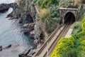 Railroad tunnel near the coast of Mediterranean sea at Cinque Terre national park, Italy Royalty Free Stock Photo