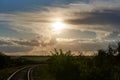Railroad turns among the green trees in the summer Royalty Free Stock Photo