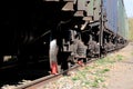 Railroad wheels of freight cars on rails with supports Royalty Free Stock Photo