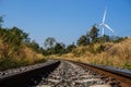 Railroad and wind turbine Royalty Free Stock Photo