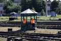 Railroad workers take a break under the gazebo Royalty Free Stock Photo