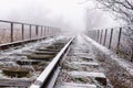 Rails in hoarfrost. Misty autumn morning Royalty Free Stock Photo