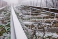 Rails in hoarfrost. Misty autumn morning Royalty Free Stock Photo