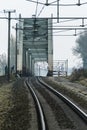 Rails and an old steel railway bridge