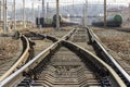 Rails, sleepers and trains with tanks at the railway freight station