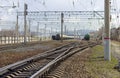 Rails, sleepers and trains with tanks at the railway freight station