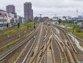 The rails of Warschauer Strasse train station and cityscape of Berlin seen from the Warschauer Bridge. Berlin, Germany.