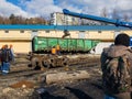 Railway accident. A crane lifts a wagon on a sunny day. Royalty Free Stock Photo