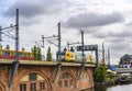 Railway arcades at the Spree in the centre of Berlin, where a light rail and a long-distance train are currently meeting