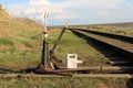Railway arrow in black with a lever and pointer in Russia. The device for the transfer of rails at intersections for