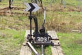 Railway arrow in black with a lever and pointer in Russia. The device for the transfer of rails at intersections for