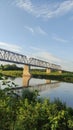 Railway bridge across river. Humanity invade into nature Royalty Free Stock Photo