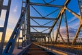 Railway bridge from the inside during repair work at sunset Royalty Free Stock Photo