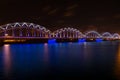 Railway bridge at night in Riga, Latvia Royalty Free Stock Photo