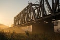 Railway bridge over the Irpin River in the autumn foggy morning