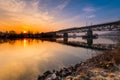 Railway bridge over the river danube in Regensburg on a cold damp winter morning at sunrise with snow Royalty Free Stock Photo