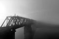 The railway bridge over the river in the fog. Railway in the morning without people Royalty Free Stock Photo