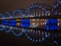 The Railway Bridge in Riga at night with beautiful reflections in the Daugava river Royalty Free Stock Photo