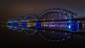 The Railway Bridge in Riga at night with beautiful reflections in the Daugava river Royalty Free Stock Photo