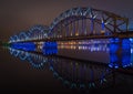 The Railway Bridge in Riga at night with beautiful reflections in the Daugava river Royalty Free Stock Photo