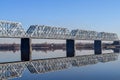 Railway bridge river and its reflection in water Royalty Free Stock Photo