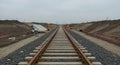 Railway construction site with workers and tracks under development Royalty Free Stock Photo