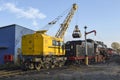 Railway crane KZH-462 `Pervomaets` loads coal steam locomotive