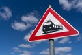 Railway crossing sign in the blue sky Royalty Free Stock Photo