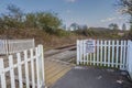 Railway crossing with sign saying to look and listen