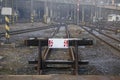 Railway deadlock with a white sign. Concept: travel is prohibited, end of the road