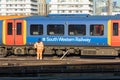 Railway Employee in Front of Moving train Royalty Free Stock Photo