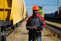 Railway employee holds in hands tablet pc and look at camera Royalty Free Stock Photo