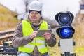 Railway employee with tablet PC near the warning lights Royalty Free Stock Photo