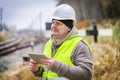 Railway engineer near rails working with tablet PC Royalty Free Stock Photo