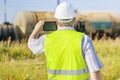 Railway Engineer with tablet PC filmed freight wagons Royalty Free Stock Photo