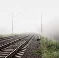 Railway in Fog. Misty Morning Landscape. Royalty Free Stock Photo