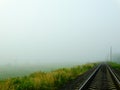 Railway in fog Royalty Free Stock Photo