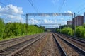 Railway. Four ways out in the distance. Electrified railway. Royalty Free Stock Photo