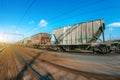 The railway hopper car for the transportation rail road train in motion at speed. Royalty Free Stock Photo