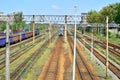 Railway infrastructure on a summer day. Tracks, rails, wires and semaphores. Royalty Free Stock Photo