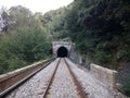 Railway leading to a tunnel in a deserted place