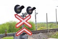 Railway level crossing with semaphore and barrier. Warning road sign on the proximity of a railway crossing Royalty Free Stock Photo