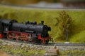 Railway model with steam locomotive and landscape details Royalty Free Stock Photo