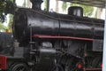 A railway museum displaying old black antique steam locomotives Royalty Free Stock Photo