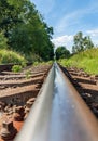 Railway old rusty track detail with landscape Royalty Free Stock Photo