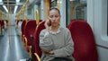 Railway passenger calling cellphone in wagon close up. Woman talking smartphone