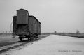 Railway platform with a carriage, coach on Oswiecim concentration camp. reads Auschwitz 2 - Birkenau