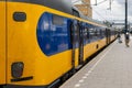 Railway platform with train ready for departure, Dutch city Groningen Royalty Free Stock Photo